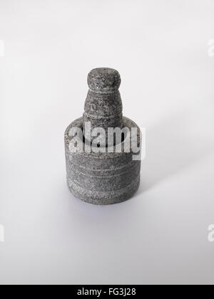 Old stone grinder on white background Stock Photo