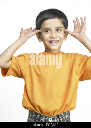 South Asian Indian boy making funny face in nursery school MR Stock ...
