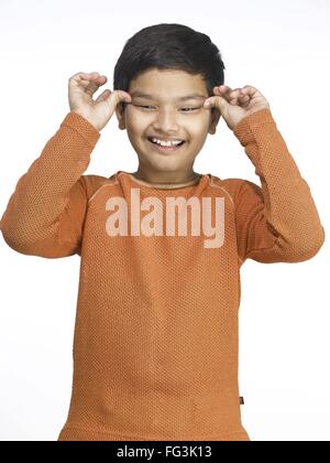 South Asian Indian boy making funny face in nursery school MR Stock ...