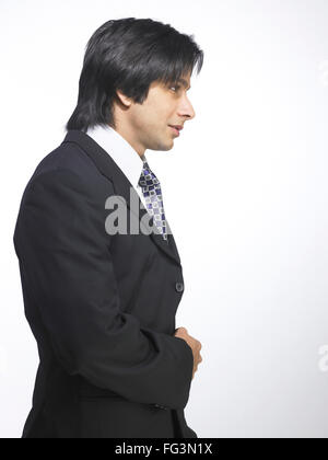 South Asian Indian executive man standing in style MR Stock Photo
