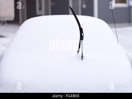 Windscreen Wiper on Snowy Car in winter time Stock Photo