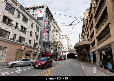 View on a street of San Francisco showing cable car power electric lines above the street Stock Photo