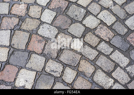 Old wet pavement with Cobblestone texture Background Stock Photo