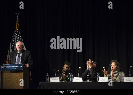 Minneapolis, Minnesota, USA. 13th Feb, 2016. Bernie Sanders delivers a campaign speech during his opening remarks before a panel of African-American activists and an audience of potential voters during the Black America Forum. Senator Bernie Sanders of Vermont, who is seeking the Democratic Party nomination for president, attended the Black America Forum, sponsored by MN Neighborhoods Organizing for Change at Patrick Henry High School in the largely African-American neighborhood of North Minneapolis, Minnesota on Friday, February 12, 2016. After beating Hillary Clinton in the New Ha Stock Photo