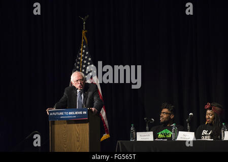 Minneapolis, Minnesota, USA. 13th Feb, 2016. Bernie Sanders delivers a campaign speech during his opening remarks before a panel of African-American activists and an audience of potential voters during the Black America Forum. Senator Bernie Sanders of Vermont, who is seeking the Democratic Party nomination for president, attended the Black America Forum, sponsored by MN Neighborhoods Organizing for Change at Patrick Henry High School in the largely African-American neighborhood of North Minneapolis, Minnesota on Friday, February 12, 2016. After beating Hillary Clinton in the New Ha Stock Photo