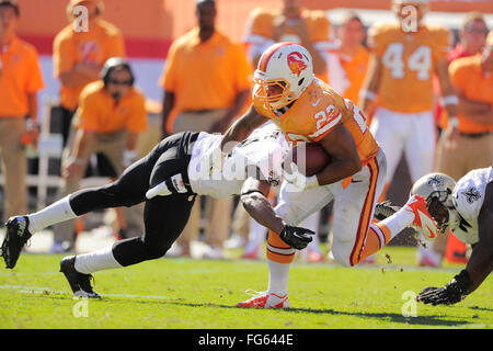 Oct. 21, 2012 - Tampa, FL, USA - Tampa Bay Buccaneers running back Doug Martin (22) is tackled by New Orleans Saints cornerback Corey White (24) during the Bucs 35-28 loss at Raymond James Stadium  on Oct. 21, 2012 in Tampa, Florida. ...ZUMA Press/Scott A. Miller. (Credit Image: © Scott A. Miller via ZUMA Wire) Stock Photo