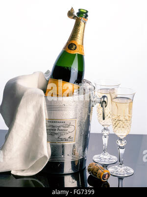 Veuve Clicquot champagne in ice-bucket with napkin and crystal glasses, London, England, United Kingdom Stock Photo