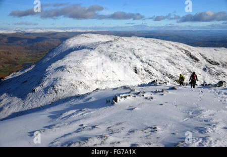 Two Walkers Heading Towards Swirl Hawse and Wetherlam from Swirl How Stock Photo