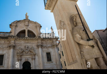 knight Orlando's Column in front of Saint Blaise's Baroque church at Luza Square on the Old Town of Dubrovnik city, Croatia Stock Photo