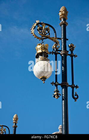 Old street lamp next to the Royal Palace of Madrid, Spain Stock Photo