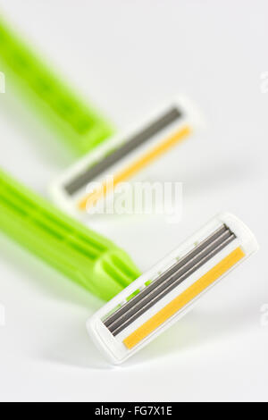 Close up of womens hand razors with aloe vera protective strip on white background Stock Photo