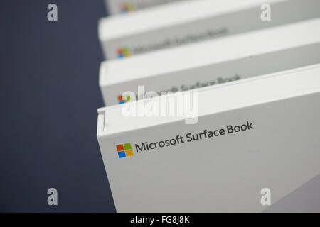 Hamburg, Germany. 18th Feb, 2016. ILLUSTRATION - 'Microsoft Surface Book' is written on computer boxes in an electronics store in Hamburg, Germany, 18 February 2016. The Surface Book has a touch screen that also allows it to be used as a tablet. Photo: LUKAS SCHULZE/dpa/Alamy Live News Stock Photo