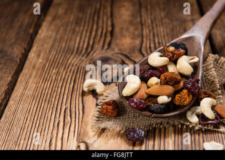 Trail Mix on wooden background (mixed dried fruits with nuts) Stock Photo