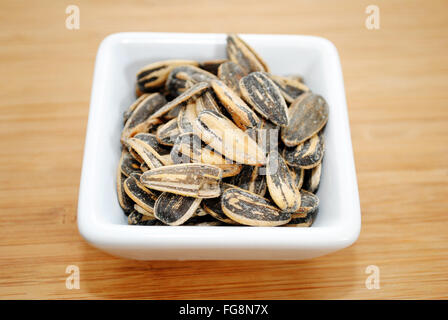 Ranch Flavored Sunflower Seeds in a White Square Bowl Stock Photo