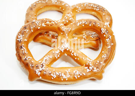 Two Soft Baked Pretzels Isolated Over a White Background Stock Photo