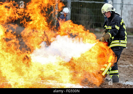 A firefighter puts out a burning gas line during training drills in Leipzig, Germany, 18 February 2016. Netz Leipzig GmbH - responsible for the gas grid in the Leipzig municipal works - drilled an accident on their 1,000km-long gas grid with the fire department. These drills are intended to help avoid catastrophes like the gas explosion in 23 October 2014 in Ludwigshafen, in which two people were killed and a tram was destroyed. Photo: JAN WOITAS/dpa Stock Photo