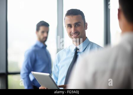 business man using tablet compuer at office Stock Photo