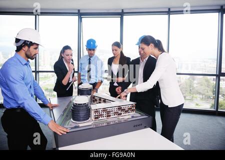 business people and engineers on meeting Stock Photo