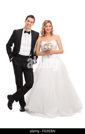 Full length portrait of a young newlywed couple posing together isolated on white background Stock Photo