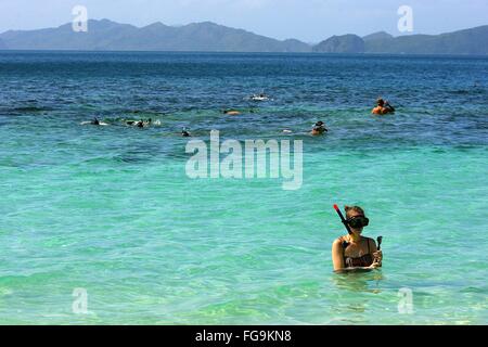 (160218) -- PALAWAN PROVINCE, Feb. 18, 2016 (Xinhua) -- Vacationers swim in the sea in Palawan Province, the Philippines, Feb. 18, 2016. Tourism revenues are expected to reach 6.5 billion U.S. dollars from the arrivals of six million foreign visitors in 2016 according to the Philippine Department of Tourism. (Xinhua/Rouelle Umali) Stock Photo