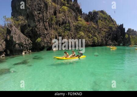 (160218) -- PALAWAN PROVINCE, Feb. 18, 2016 (Xinhua) -- Vacationers take kayaks to tour around limestone formations in Palawan Province, the Philippines, Feb. 18, 2016. Tourism revenues are expected to reach 6.5 billion U.S. dollars from the arrivals of six million foreign visitors in 2016 according to the Philippine Department of Tourism. (Xinhua/Rouelle Umali) Stock Photo