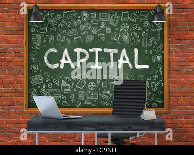 Capital on Chalkboard in the Office. Stock Photo