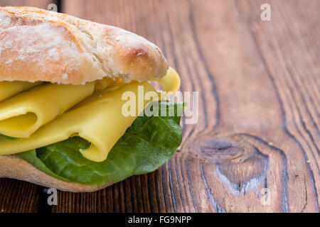 Cheese Sandwich (close-up shot) on vintage wooden background Stock Photo