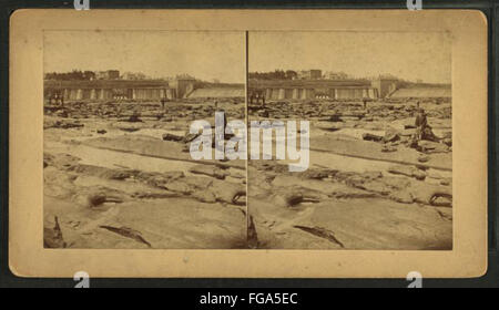 Connecticut River Dam at low water, boys posing on rocks in foreground, by Milan P. Warner Stock Photo