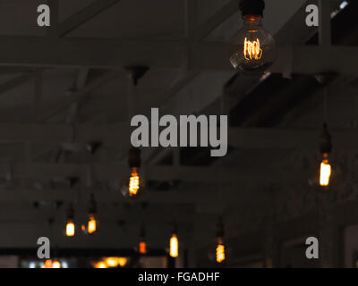 Low Angle View Of Illuminated Light Bulbs Hanging On Ceiling