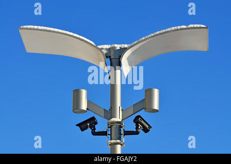 Surveillance cameras and modern lighting fixtures on the lamppost Stock Photo