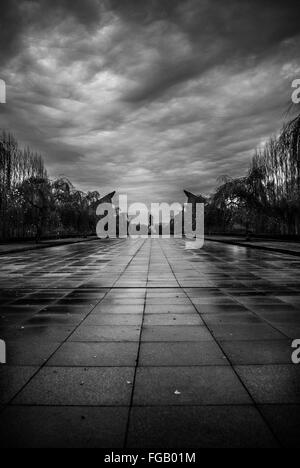 Distant View Of Soviet War Memorial In Treptower Park Against Cloudy Sky