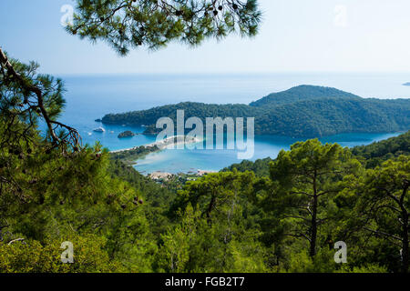 A aerial view through the pine trees of Olu Deniz and the blue lagoon, Fethiye, Turkey. Stock Photo