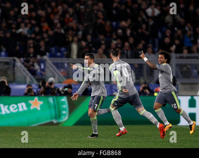 Rome, Italy. 17th Feb, 2016. Real MadridÕs Cristiano Ronaldo, left, celebrates with teammates Sergio Ramos, center, and Marcelo after scoring during the first leg round of 16 Champions League soccer match between Roma and Real Madrid, at the Olympic stadium. Real Madrid won 2-0. © Riccardo De Luca/Pacific Press/Alamy Live News Stock Photo