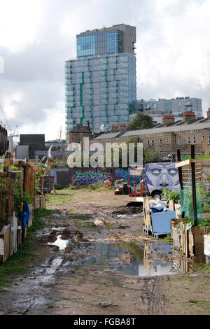 A view of a newly built block of flats, from the nomadic community gardens in Brick Lane Stock Photo