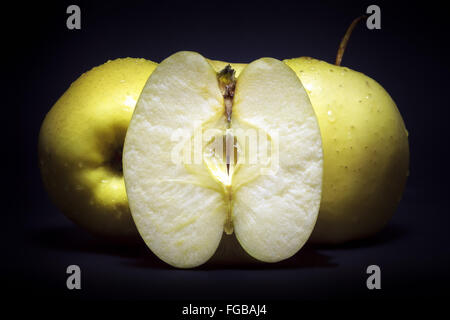 Golden delicious apples on black background Stock Photo