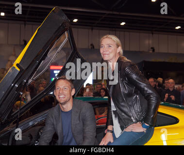 Jenson Button and Jodie Kidd pose by a McLaren F1 on media day, at the London Classic Car Show 2016 Stock Photo