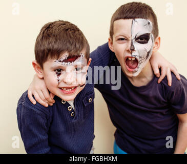 zombie apocalypse kids concept. Birthday party celebration facepaint on children dead bride, scar face, zombi skeleton together Stock Photo