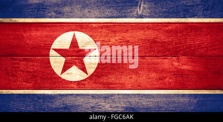 flag of North Korea or Korean banner on wooden background Stock Photo