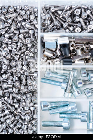 Different Screws and other Parts sorted in a box (close-up shot) Stock Photo