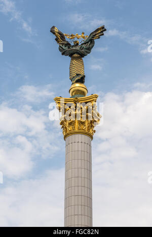 Independence Monument with Berehynia statue on Maidan Nezalezhnosti square in Kiev, Ukraine. Centra Post Office on background Stock Photo