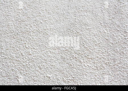 White stucco textured wall background with natural light. Stock Photo
