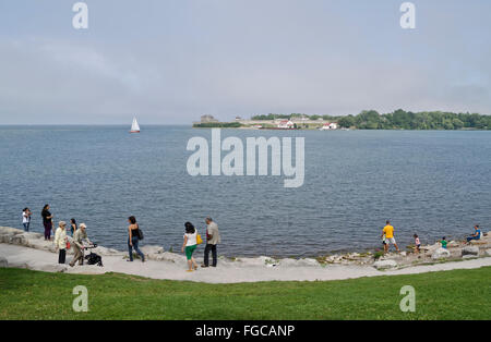 People walking along the shore of Lake Ontario in Niagara-on-the-Lake, ON. Stock Photo