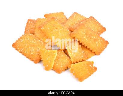 Cookies crackers biscuits sprinkled with sesame on a white background. Stock Photo