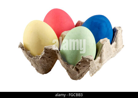 Isolated colorful easter eggs in stand over white Stock Photo