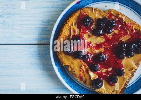 Sandwich with peanut butter and black currant jam Stock Photo