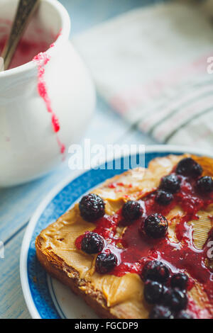 Sandwich with peanut butter and black currant jam Stock Photo