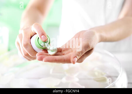 Hands, hand hygiene. Salon, care treatment for hands. A woman washes her hands with soap in foam Stock Photo