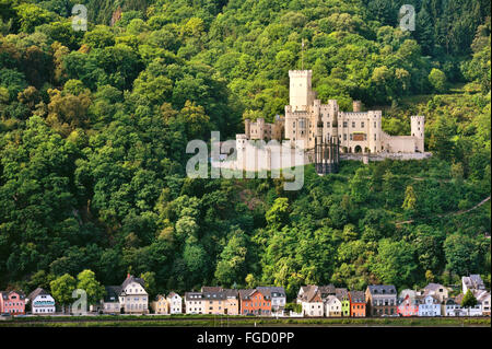 Stolzenfels Castle near Koblenz and lined colored houses at the river bank of the Rhine, Upper Middle Rhine Valley, Germany Stock Photo