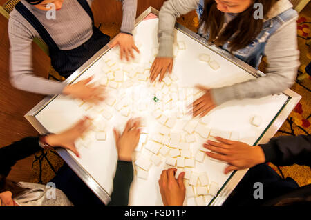 People playing Mahjong, Hong Kong, China. Stock Photo