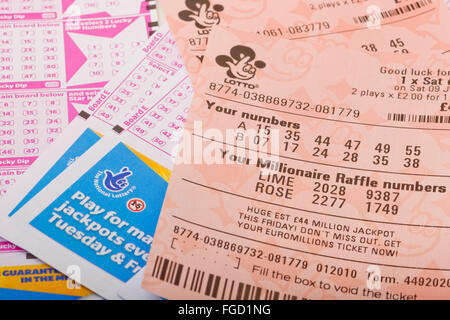 Close up of National Lottery Lotto jackpot tickets and slips ticket slip England UK United Kingdom GB Great Britain Stock Photo